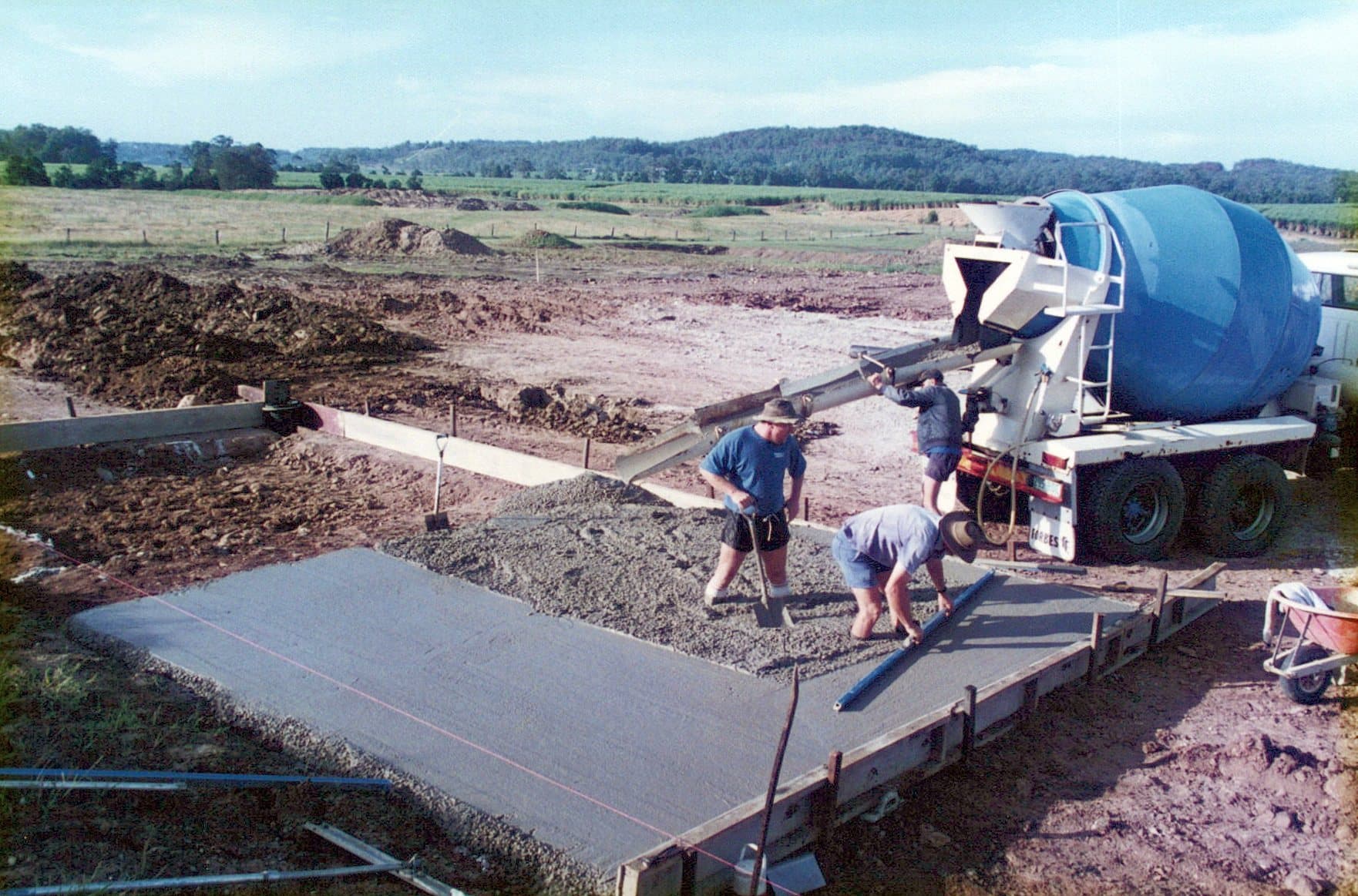 concrete mixer in action at a construction site...